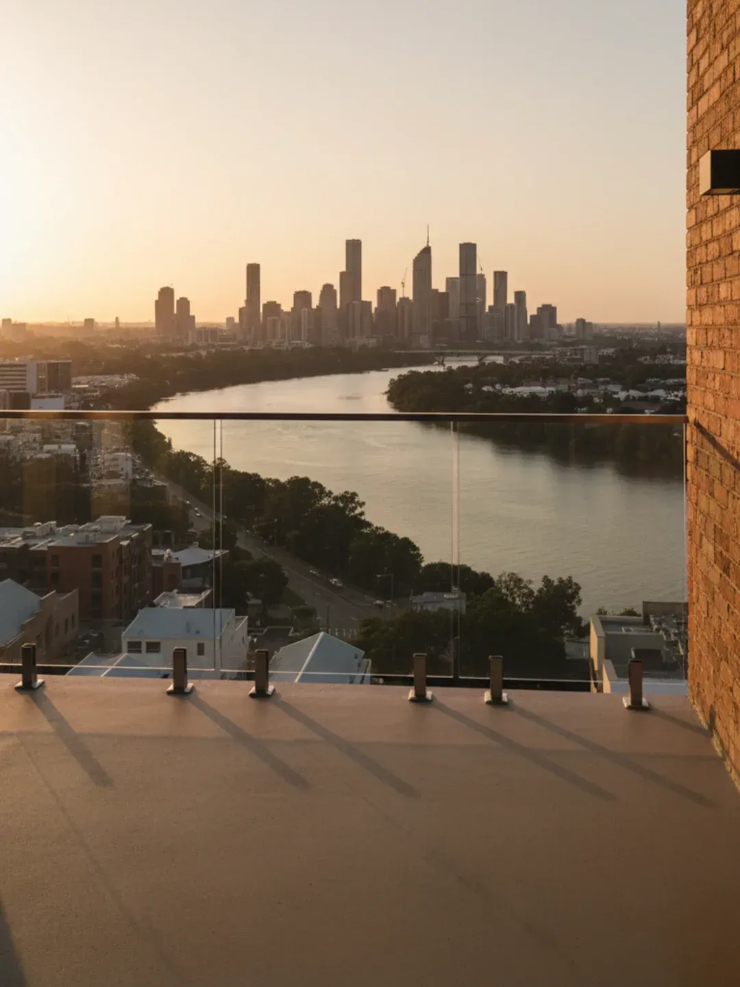 Modern frameless glass balustrades Teneriffe enhancing river and skyline views with safe compliant installation.